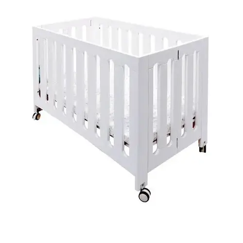 Caden Wood Folding Crib Designed For Small Spaces In White Caden Wood Folding Crib Designed For Small Spaces In White