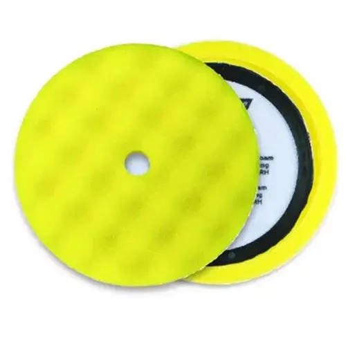 Yellow foam grip pad with convoluted face pattern and center ring Yellow foam grip pad with convoluted face pattern and center ring
